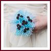 Bouquet demoiselle d'honneur organza turquoise et roses chocolat